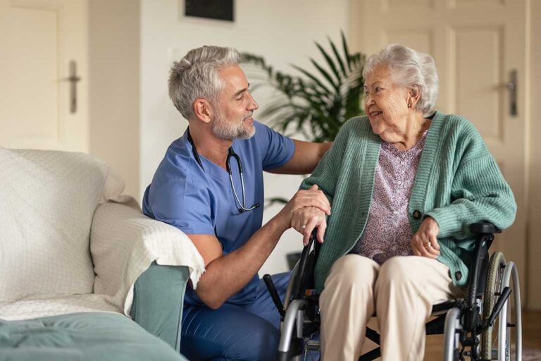Family members review a daily care checklist with an older adult at a kitchen table. KEYWORDS: ["assisted living care assessment", "family discussing senior care needs", "older adult daily support checklist"]